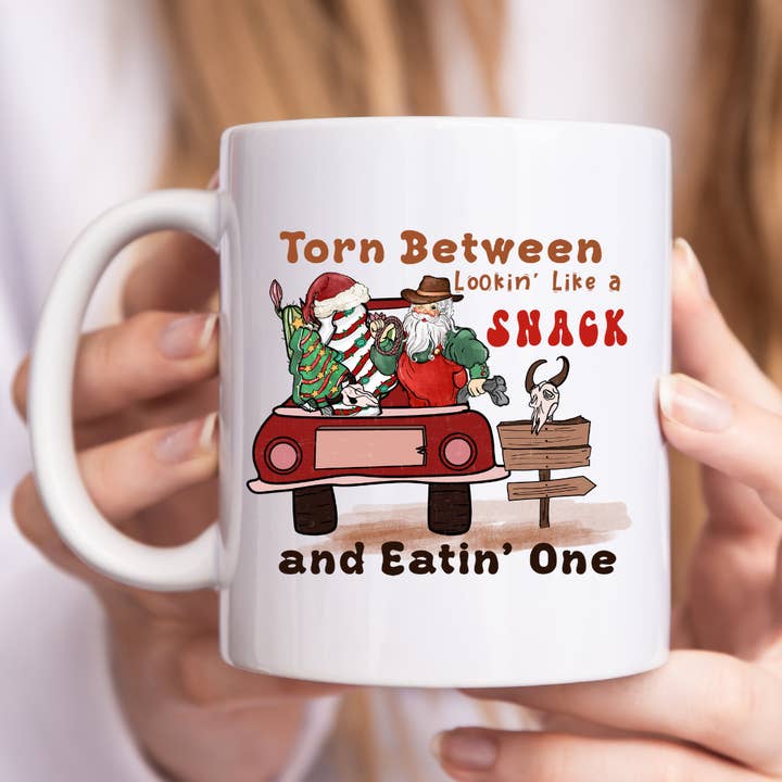 Torn Between Lookin Like a Snack and Eatin One Christmas Mug for wholesale by Mug Boss Inc.