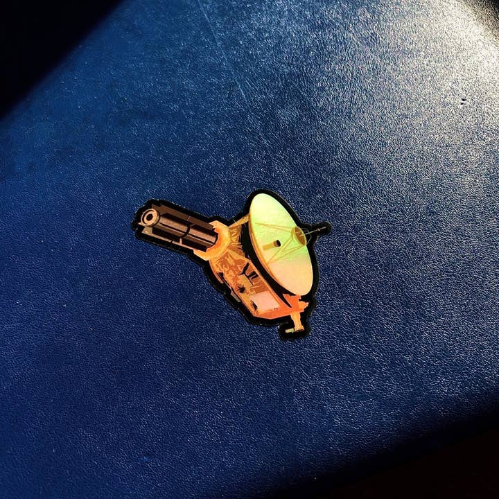 Først hos Pluto: New Horizons Holographic Style Sticker for engroshandel hos Chop Shop Store