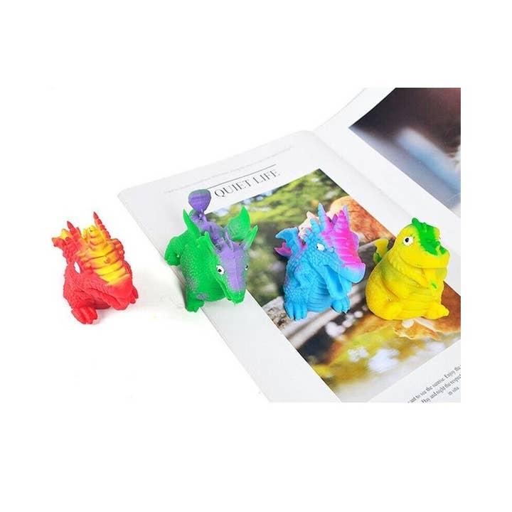 MIX COLOR Treasure Box Reversible Dinosaur Egg Squishies for wholesale on Faire