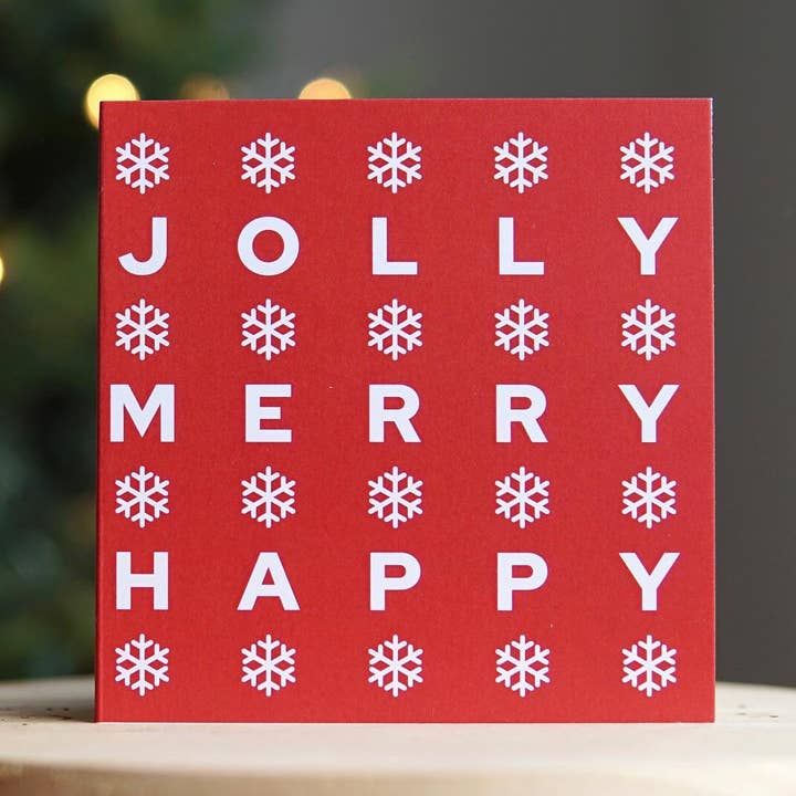Biglietto di auguri di Natale con scritta «Jolly, Merry, Happy» per la vendita all'ingrosso da parte di The Forgetful Collective