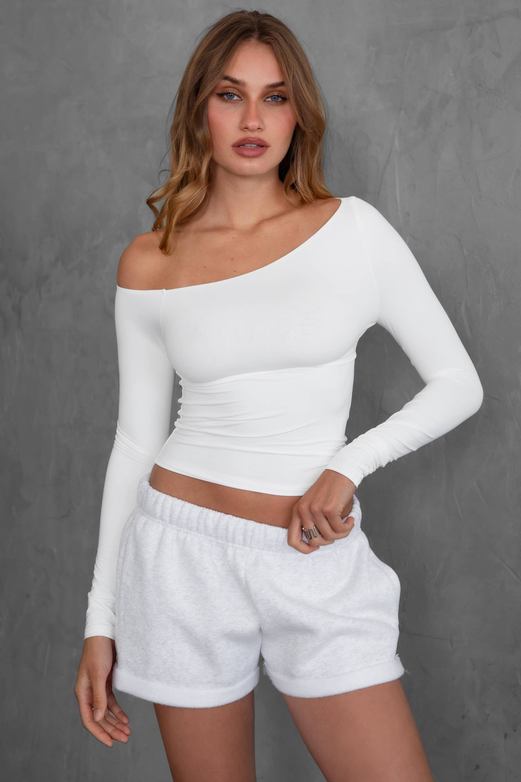 White AUDREE One-Shoulder Assymetrical Neckline Long-Sleeve Top for wholesale on Faire