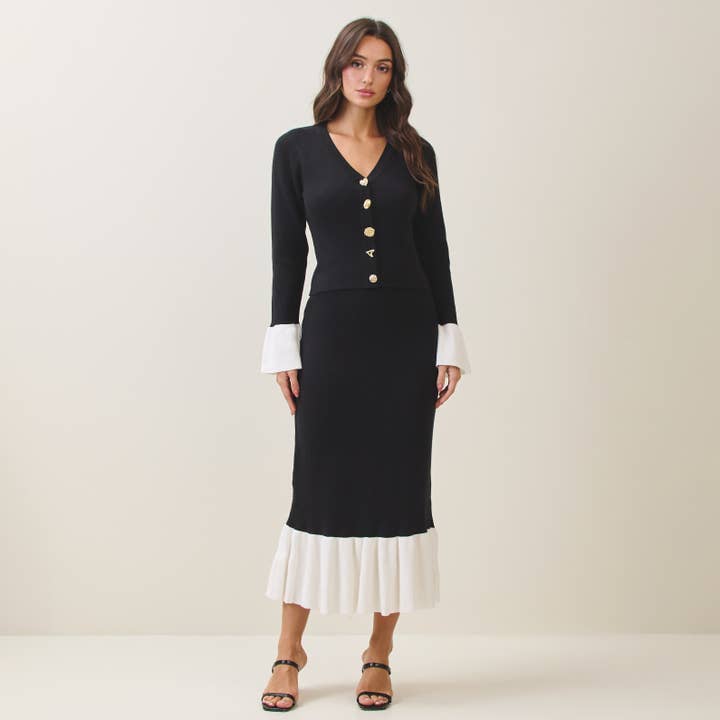 Completo maglia e gonna bicolore con bottoni gioiello per la vendita all'ingrosso da parte di Able