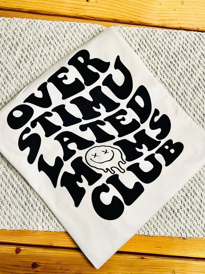 T-shirt Over Stimulated Moms Club pour la vente par Tay n. Co
