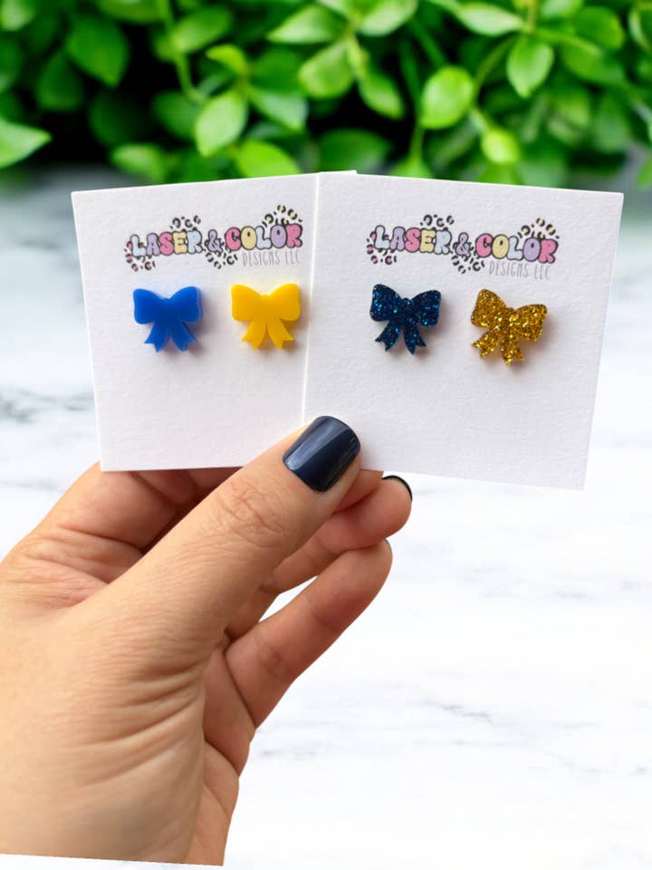 Down Syndrome Bow Earrings, Team Spirit Earrings for wholesale by Laser & Color Designs LLC