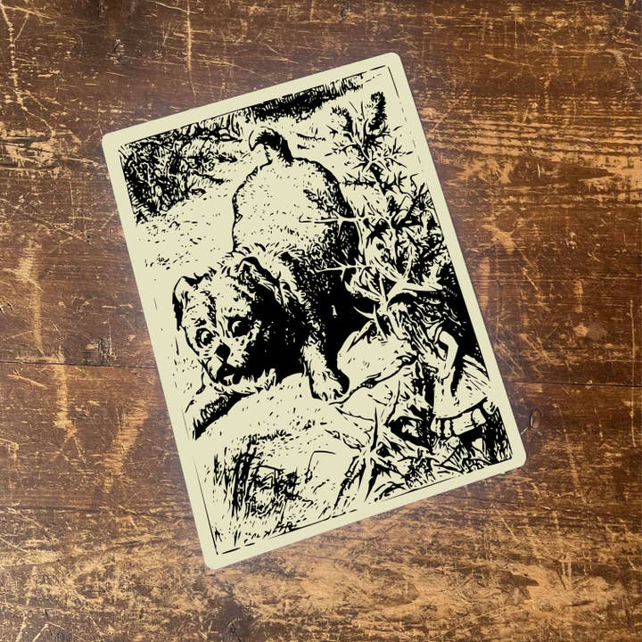 Enseigne en métal avec illustration de chien Alice au pays des merveilles pour la vente par The British Metal Signs Company