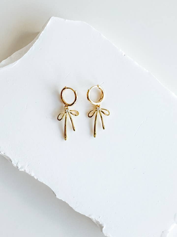 Coquette Bow Gold Filled Huggie Hoop Earrings for wholesale by Hello Heather