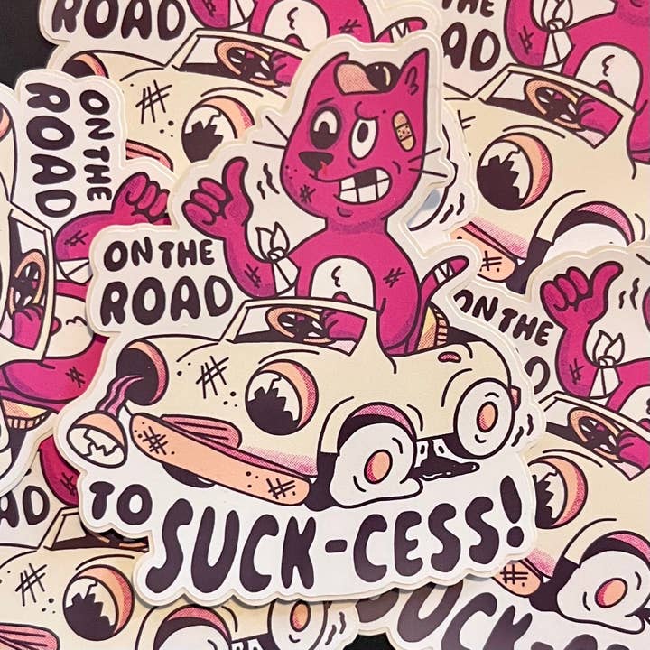 On The Road To Suck-cess Funny Driving Cat Vinyl Sticker for wholesale by Madkapp Stuff