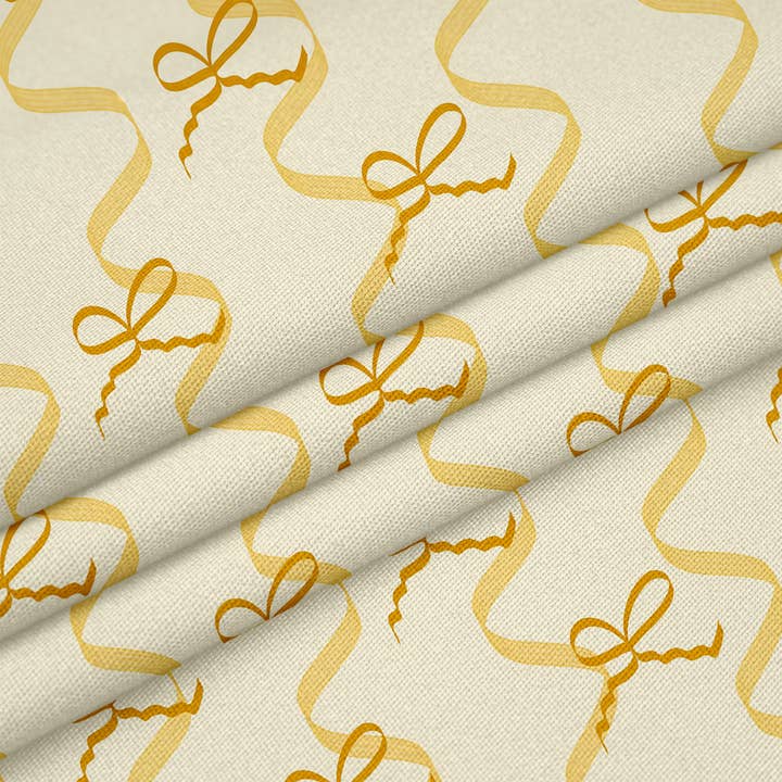 ‘Mad About The Bows’ fabric with bows and ribbons in sunshine yellow for wholesale by Sorbet Dreams