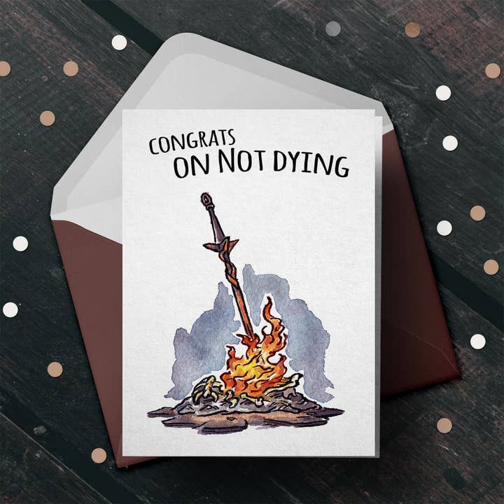 "Congrats on Not Dying" - Black Soul Birthday Card for Gamer for wholesale by Aaron Millard Illustration