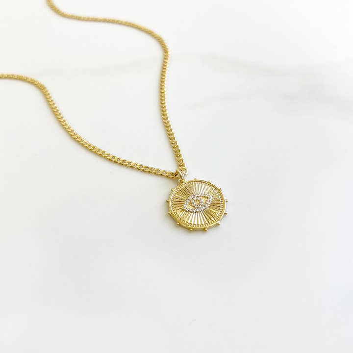 Collier pendentif pièce œil maléfique or scintillant pour la vente par iiShii designs