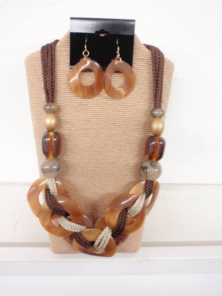 BROWN CORD WITH NATURAL GOLDEN ROUND HORN STATEMENT NECKLACE for wholesale by International Duru's