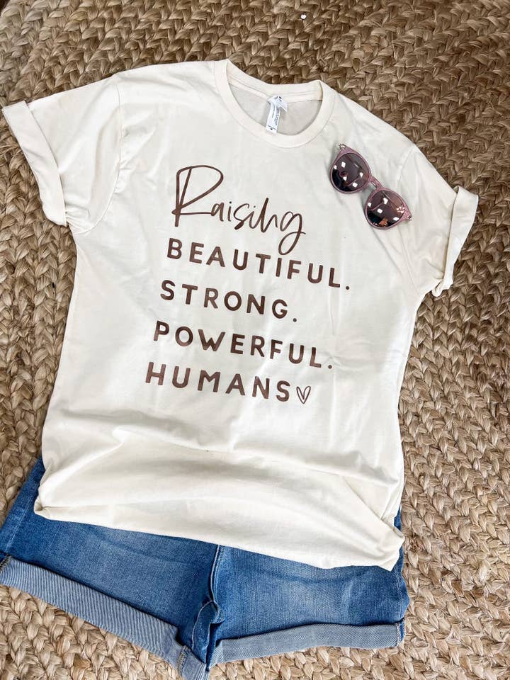 Élever des humains beaux, forts et puissants | Women's Graphic pour la vente par Bizzy's Wholesale
