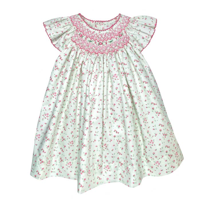 Engelenvleugeljurk met handgeborduurde bischopssmok. voor wholesale door Petit Ami & Zubels