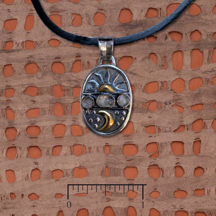 Sun and moon sterling silver pendant with rainbow moonstone
for wholesale by Tidepool