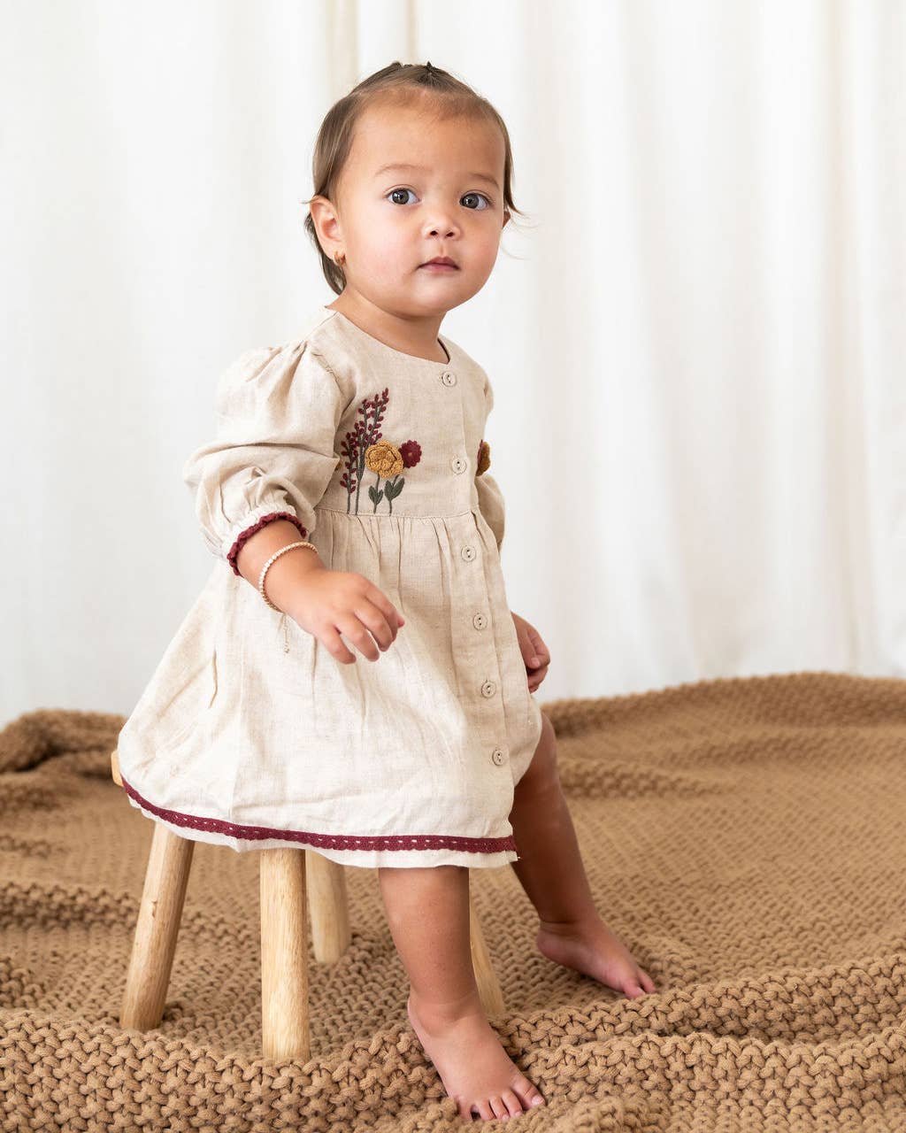 Natural Ravello Embroidered Baby Dress & Bloomer (Linen Blend) for wholesale on Faire10