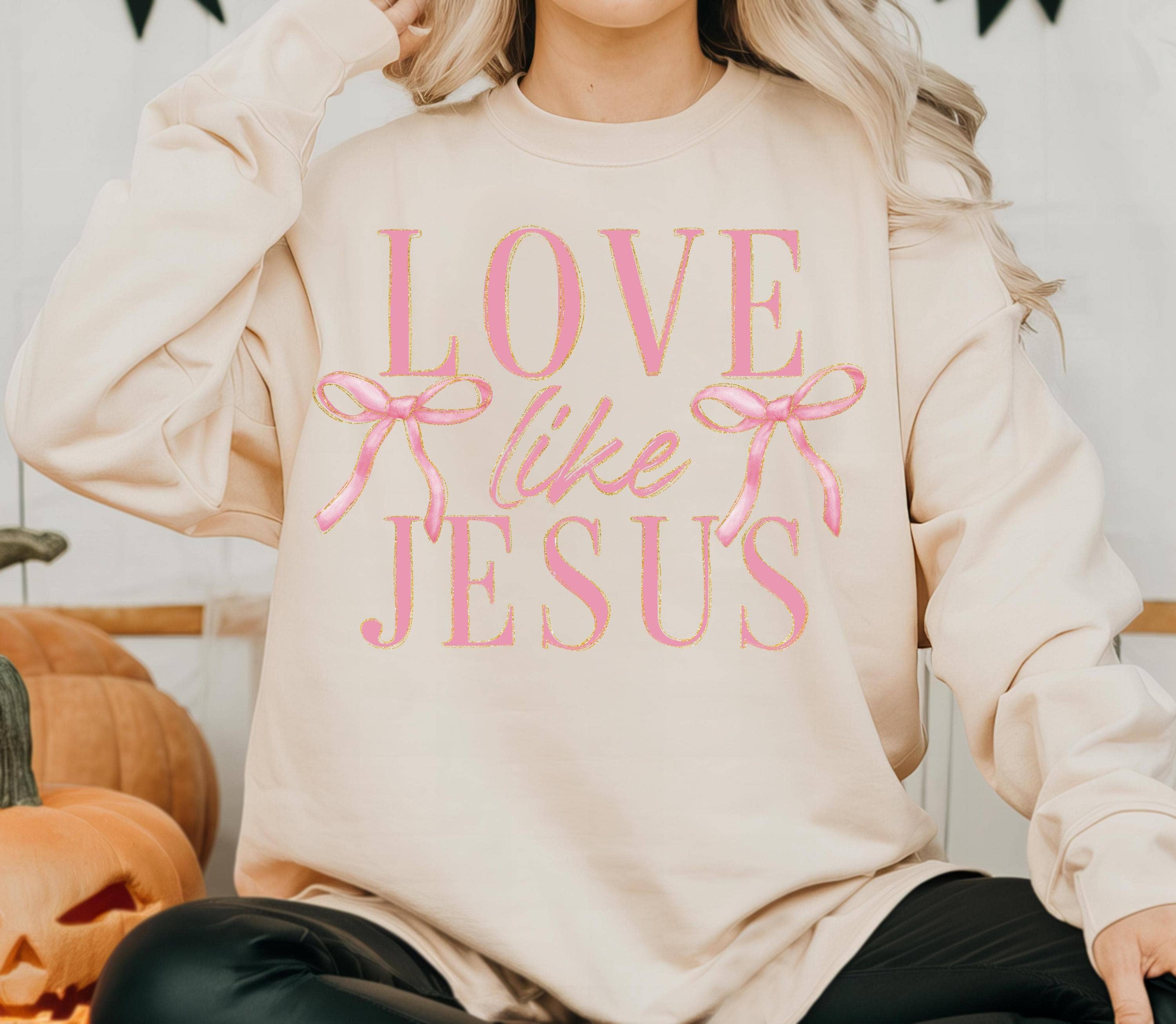 NVC Ecommerce LLC – Großhandel Sweatshirt mit Grafikdruck – Damen – Love Like Jesus Sweatshirt mit rosa Schleifen-T-Shirt2