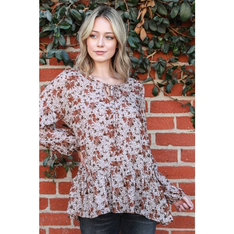 Moka Top con maniche a sbuffo con peplo floreale in vendita all'ingrosso su Faire1
