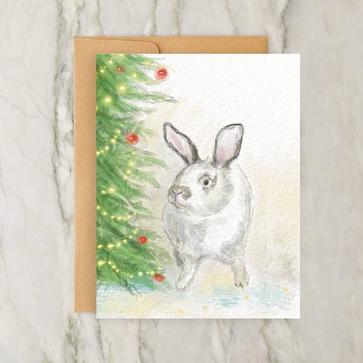 Bunny Next to Holiday Tree 4x5" Christmas Greeting Card for wholesale by Hudson Illustration Co - About Town Co