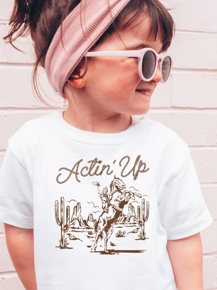 Acting Up Cowgirl Western Toddler Graphic Tee for wholesale by Uncommon Label
