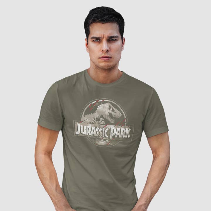 T-shirt Jurassic Park - Classic Logo Cracked pour la vente par COTTON DIVISION