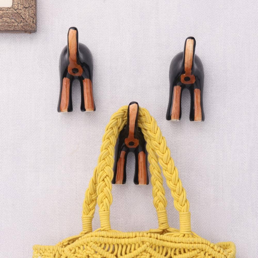 3 Piece Ceramic Dog Tail Wall Hook Black and Brown for wholesale on Faire0