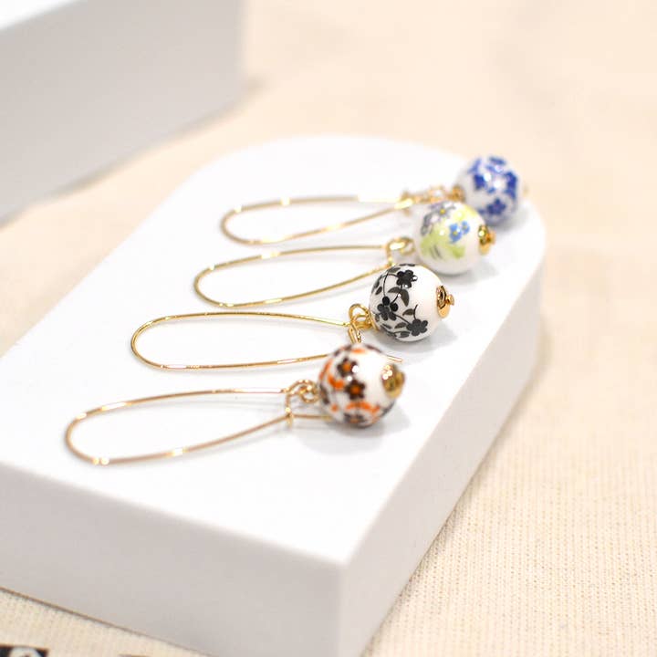 StarryNYC - Wholesale Hangende/ronde oorbellen - Oorbellen van Murano-glas met bolletjes en nierdraad