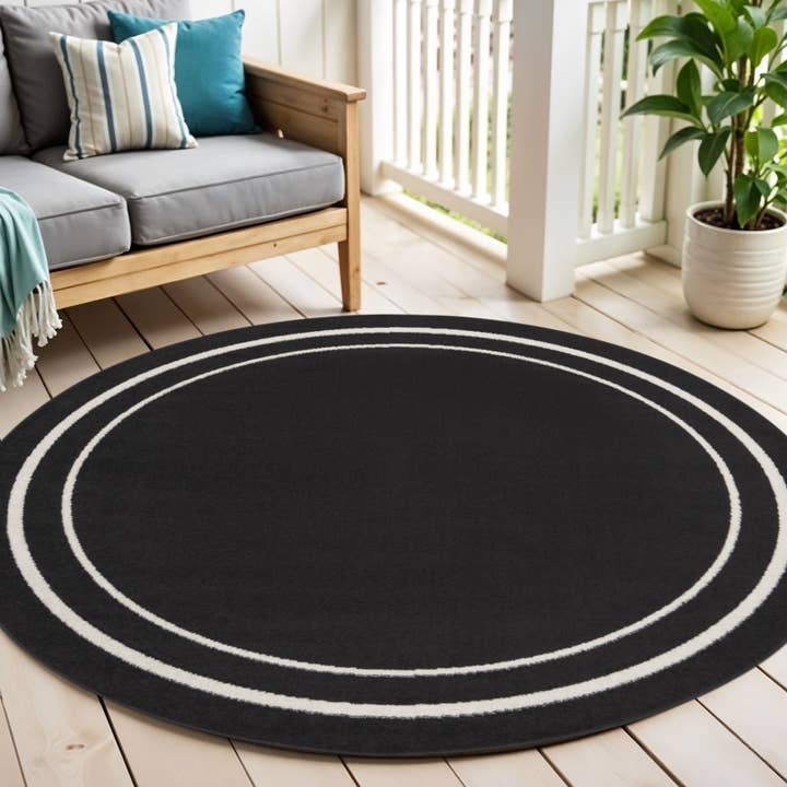 6' Black And Ivory Round Indoor Outdoor Area Rug for wholesale by HomeRoots