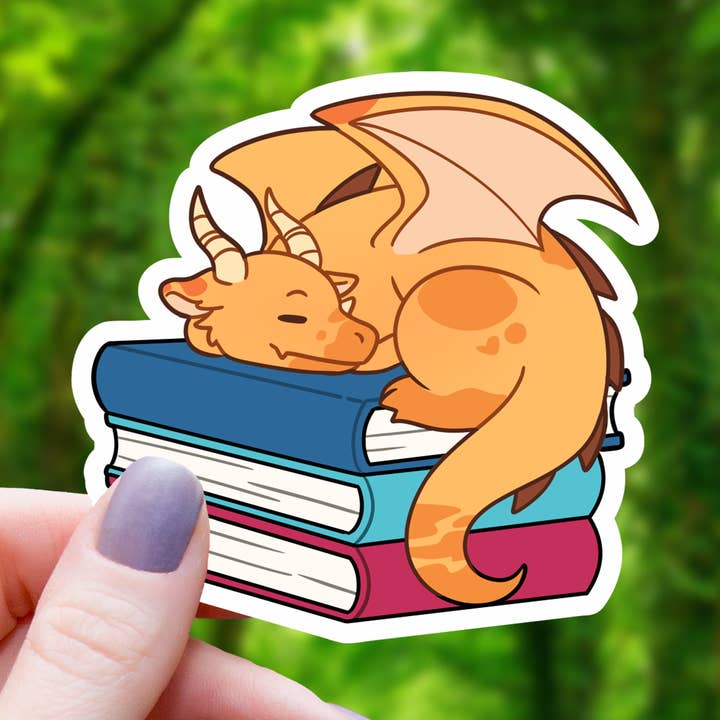 Orange Dragon Sleeping On Book Pile Sticker - 3 for wholesale by Mimic Gaming Co
