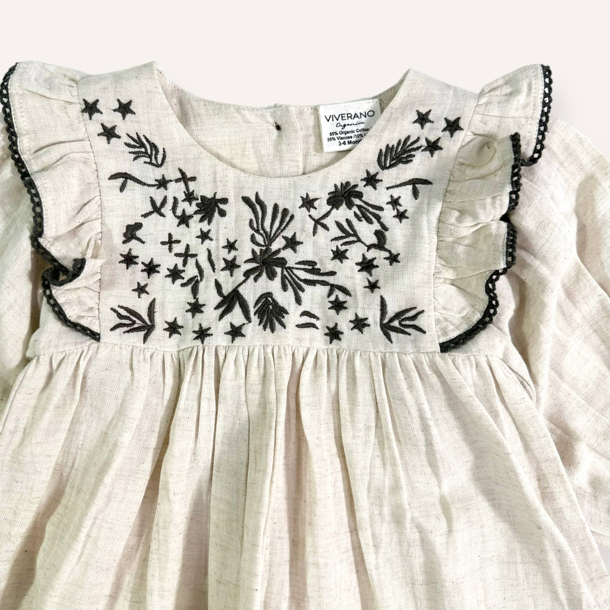 Natural Heather Embroidered Ruffle Flare Baby Dress (Organic Cotton / Linen) for wholesale on Faire2