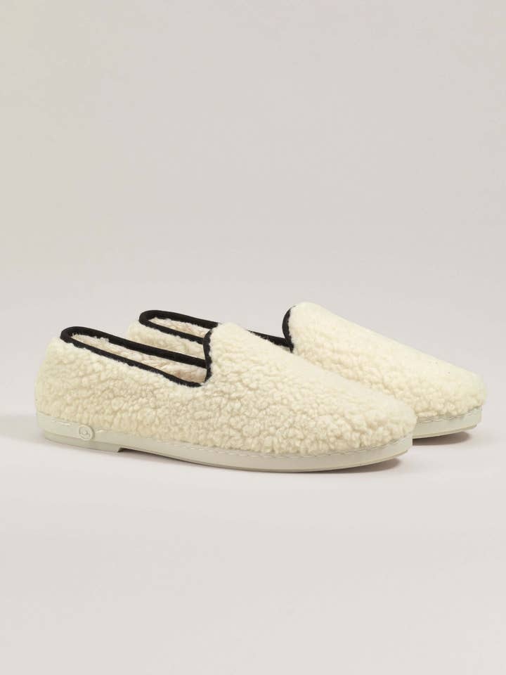 Damtoffel i ullslinga, vit svart för wholesale av Angarde