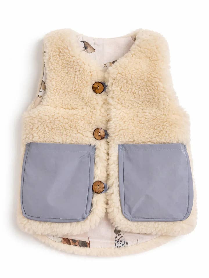 Gilet en laine vierge pour bébé/enfant - Blanc/Bleu pour la vente par Mellow