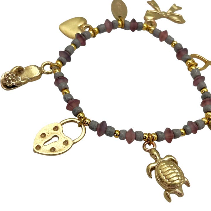 Gloria Mago - Wholesale Charm/Dangle Bracelet - Elastic bracelet with gold charms and pink-tone resin beads2