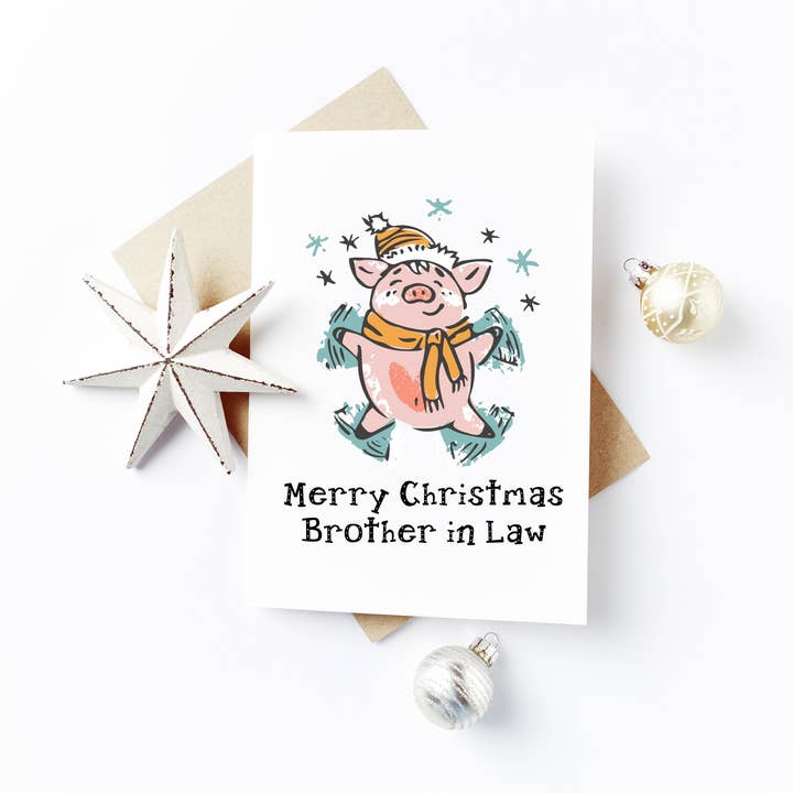 Merry Christmas Brother in Law Card - Snow Angel Pig Design for wholesale by Flash On A String Designs