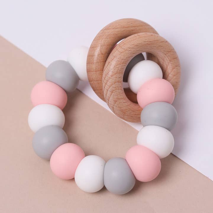 Baby pink Mix Silicone and Beechwood Teether for wholesale by Pops and Dudes