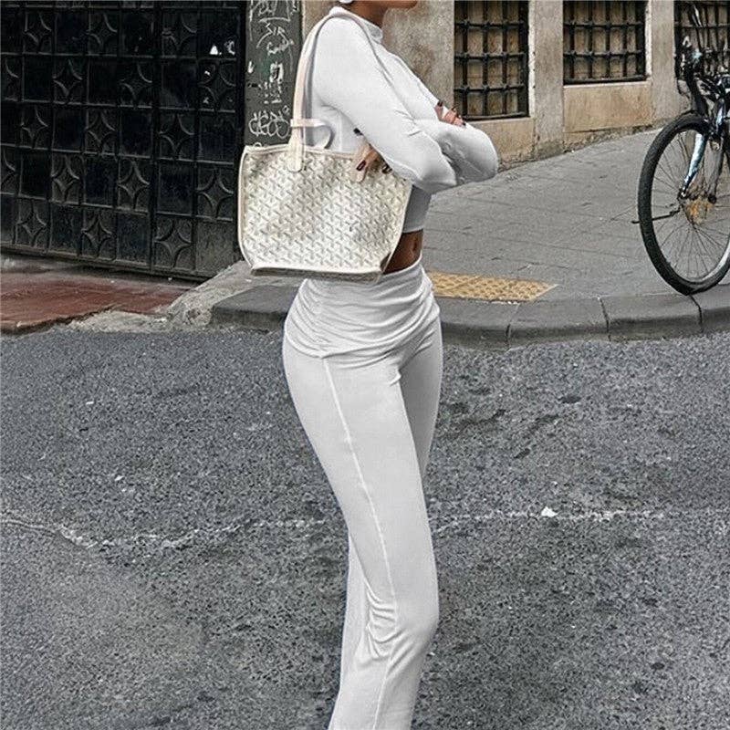 BIANCO Set di abbigliamento sportivo a tinta unita con maglia a maniche lunghe slim fit e pantaloni. in vendita all'ingrosso su Faire3