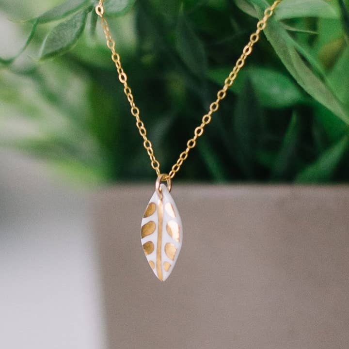 leaf necklace with gold detail for wholesale by Remnant Studios