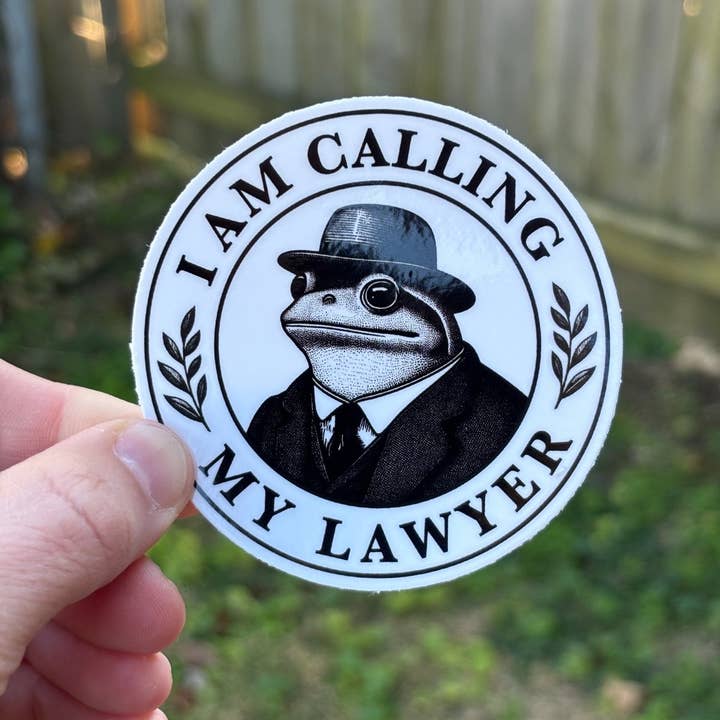 I am calling my lawyer sticker. Frog lawyer sticker. for wholesale by Pretty Bad Co