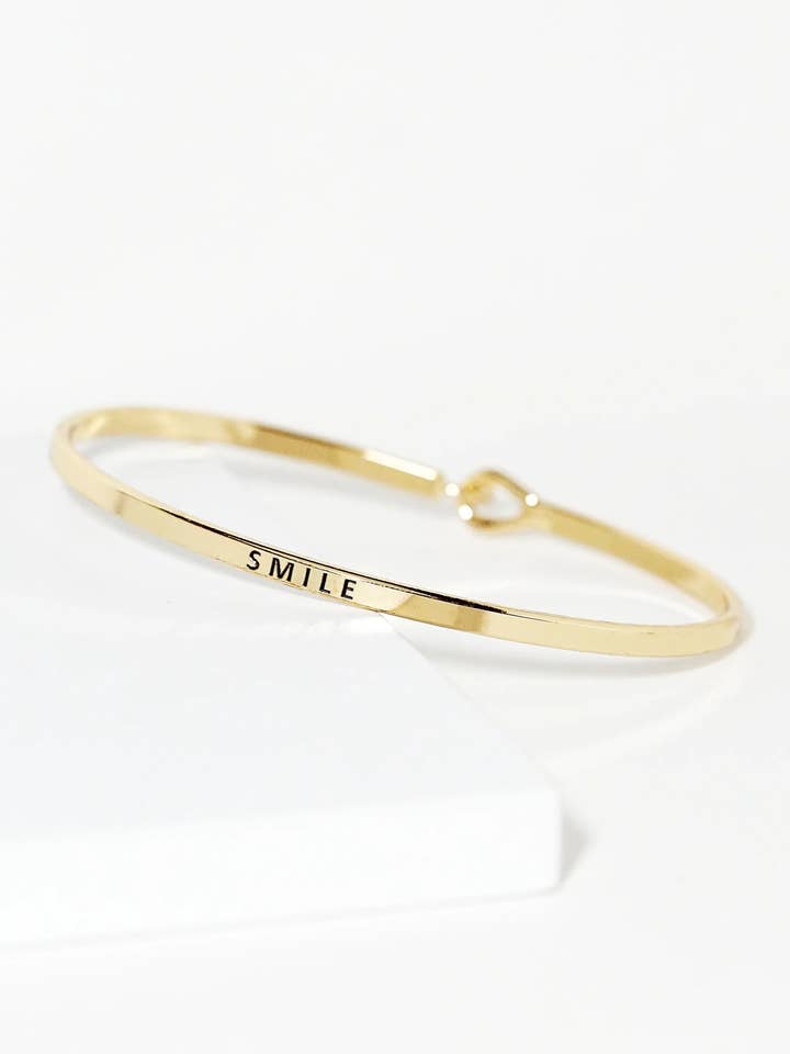 Smile Engraved Inspirational Bangle Bracelet for wholesale by Wild Honey