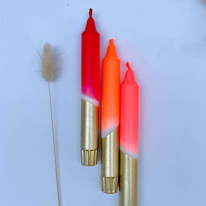 Red, Neon Coral, Neon Orange & Gold Dip Dyed Dinner Candles for wholesale by The Singing Rabbit
