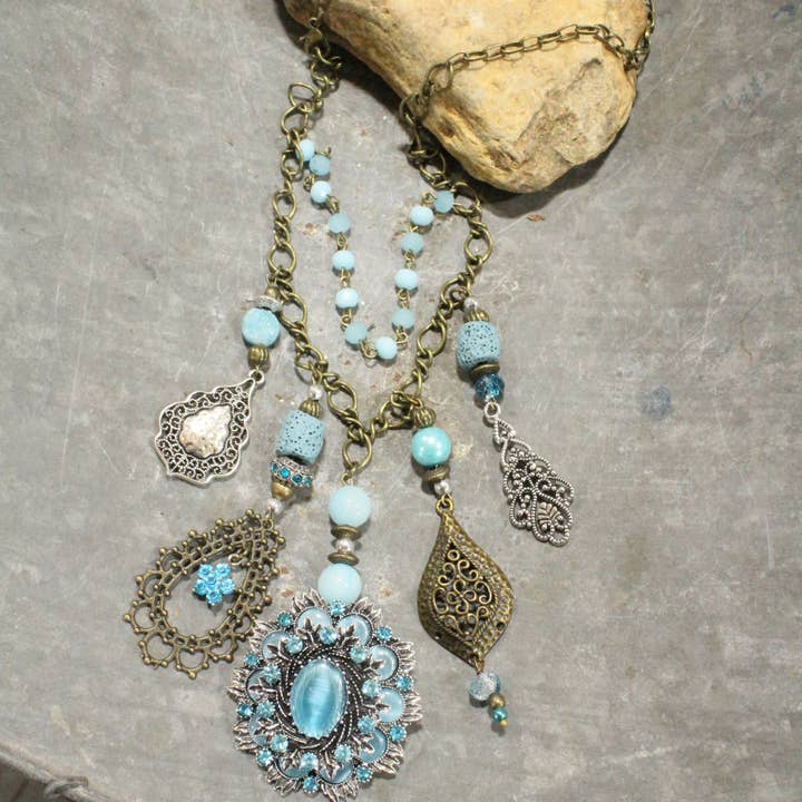 The Primitive Peddler, Inc. - Wholesale Pendant/Charm Necklace - Embellishments Of Bronze & Silver Charming Blue Pendant Layered Necklace