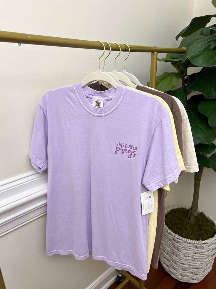 Orchid This Mama Prays Embroidery Tees Faith Based Christian Catholic Tshirts for wholesale on Faire0