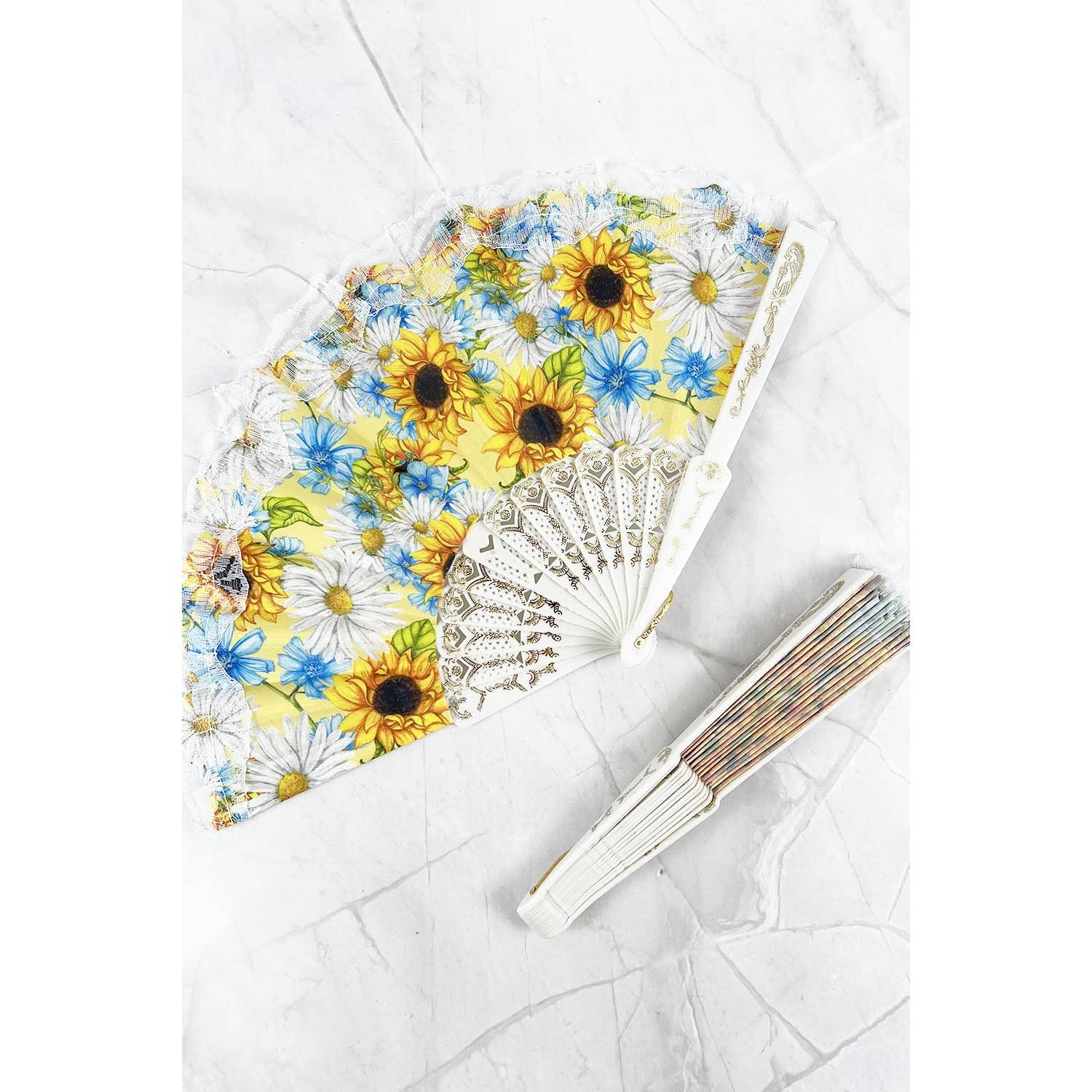 ASSORTED SUN FLOWER PRINT HAND HELD PLASTIC FOLDING FAN for wholesale on Faire2