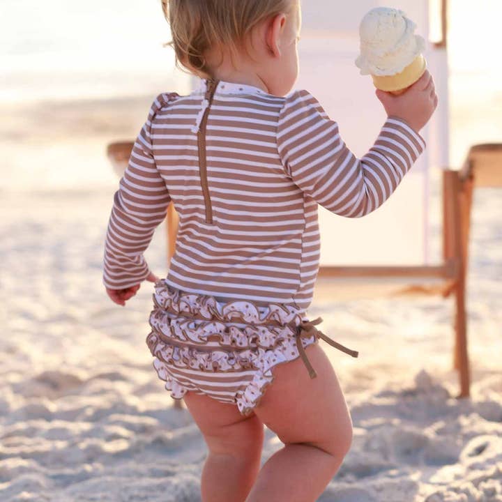Long Sleeve Rash Guard With Ruffle Bottom | Sandy Stripes for wholesale by Caden Lane
