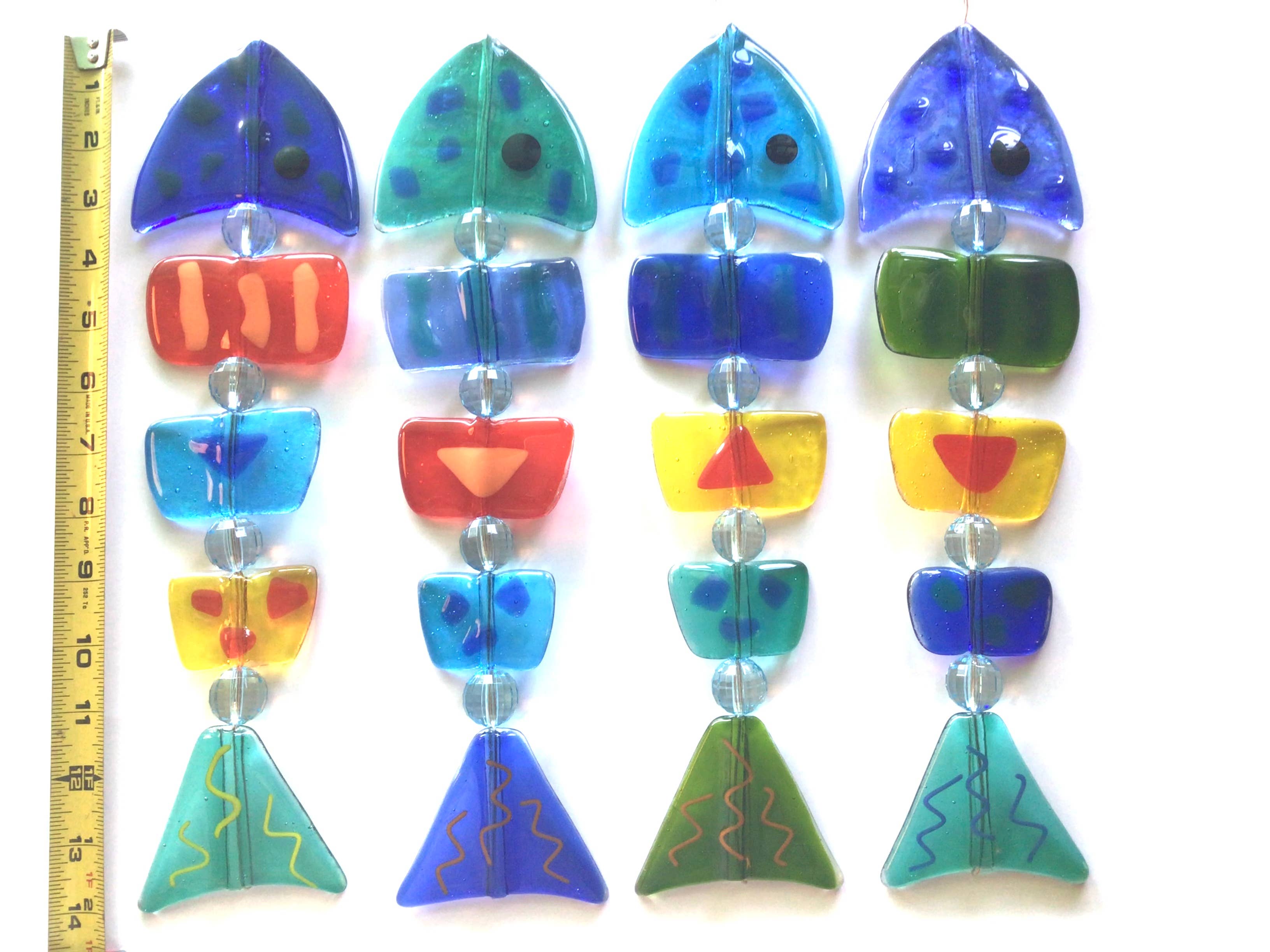 Diverse kleuren Damevis glazen vis mobiel, zonnevanger voor groothandel op Faire1