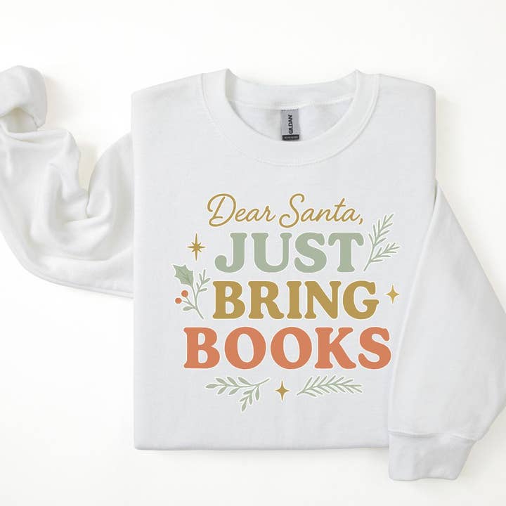 "Felpa Accogliente 'Caro Babbo Natale, Porta Solo Libri'" per la vendita all'ingrosso da parte di The Obstinate Octopus