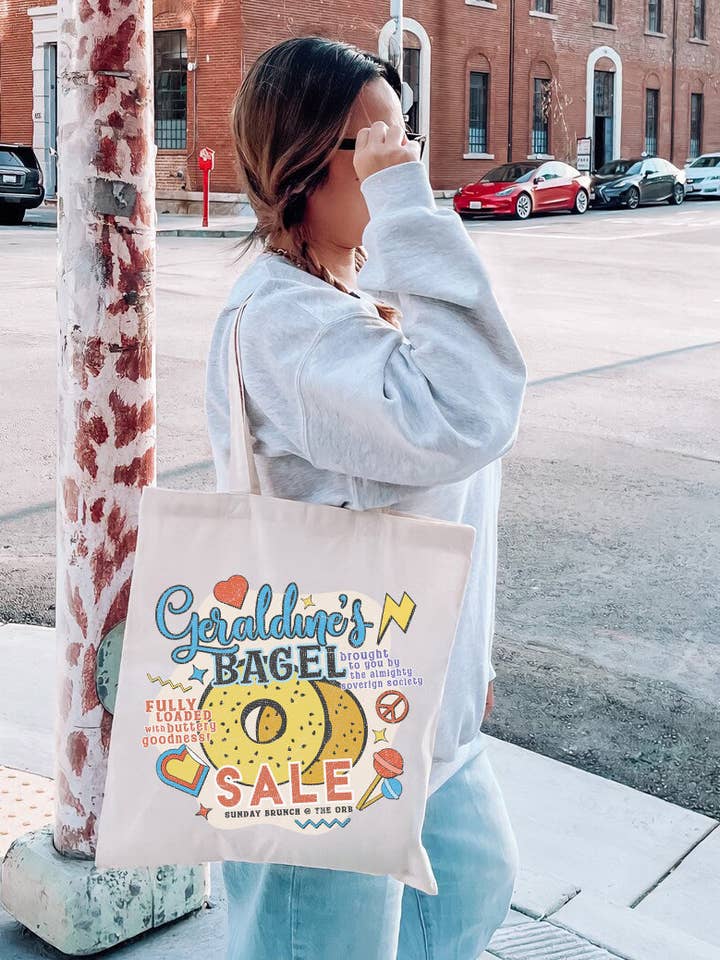 Geraldine's Bagel Sale Tote Bag | Zodiac Academy for wholesale by Narrative Threads