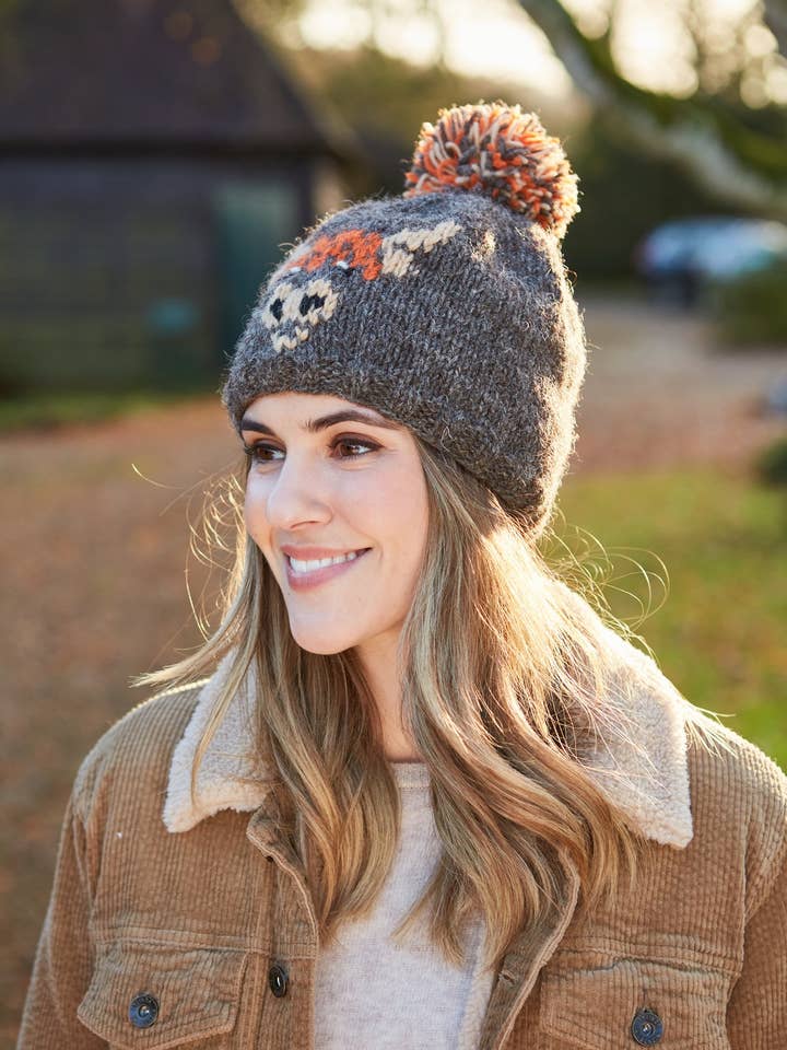 Highland Coo Knitted Wool Brown Bobble Beanie Hat for wholesale by Pachamama Ltd