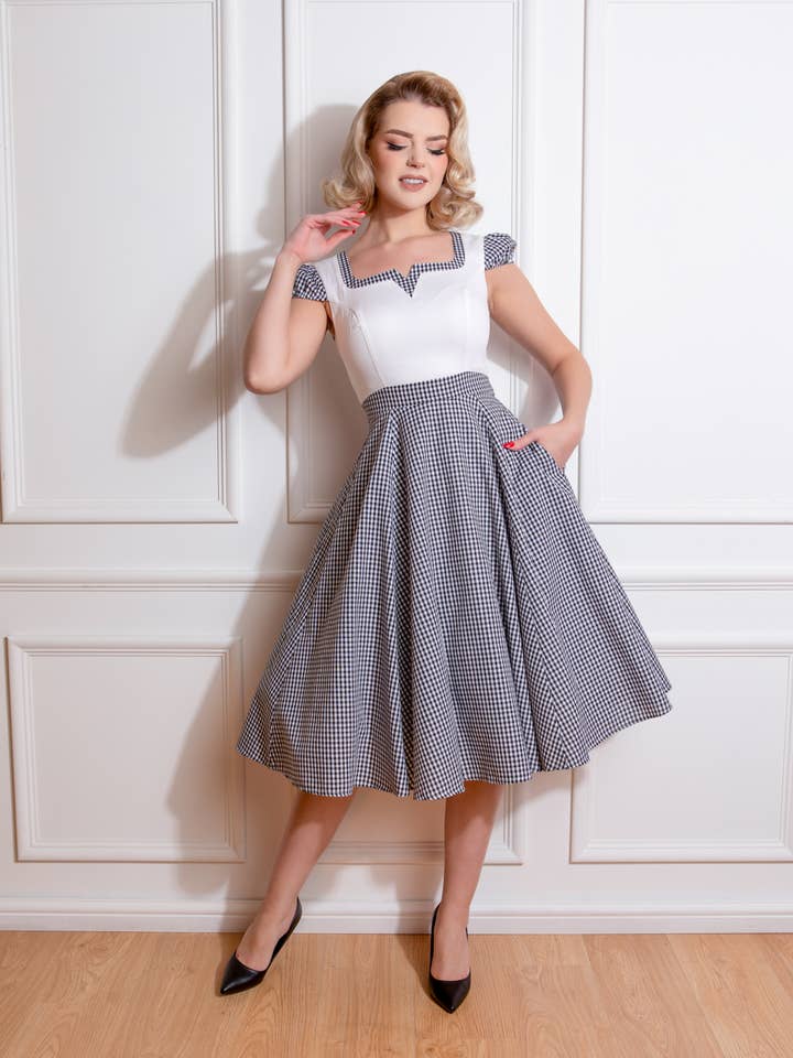 Chelsea Check Swing Dress in Black for wholesale by Hessar Trading CO LTD