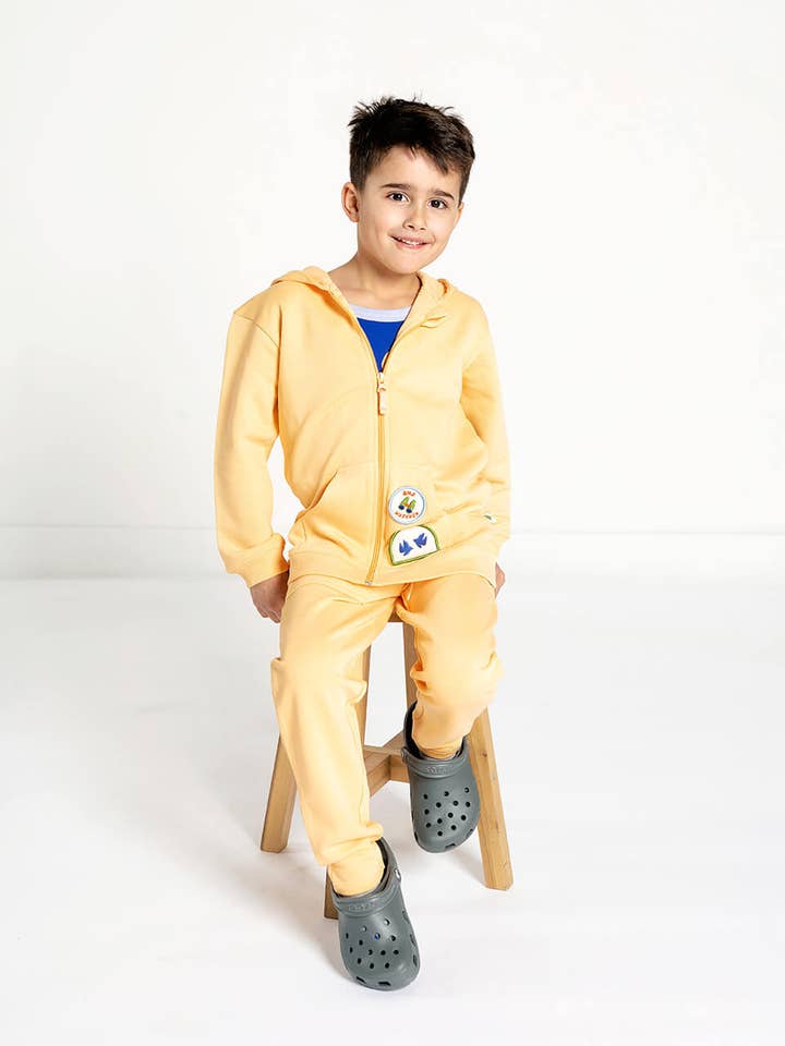 Pantalon de jogging jaune en coton biologique pour enfants pour la vente par Crann Organic