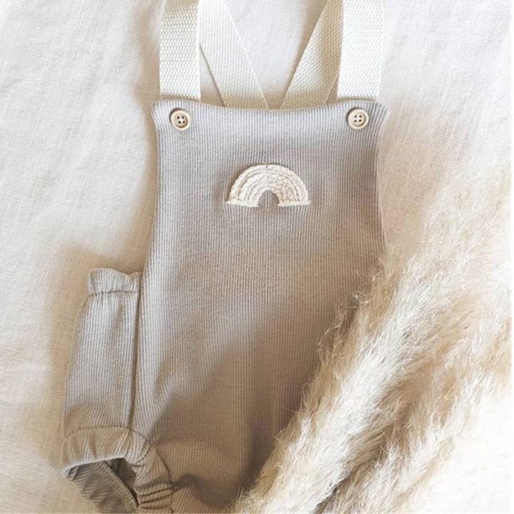 Annie & Charles® rainbow bib onesie for wholesale by Annie & Charles